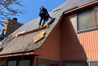 Elevation roofing crew working on a Houston home