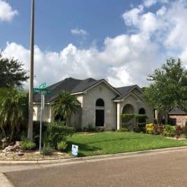 Texas home with a newly financed roof replacement against a clear sky