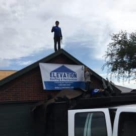 Professional roofing contractor inspecting an asphalt shingle roof on a Houston, Texas home
